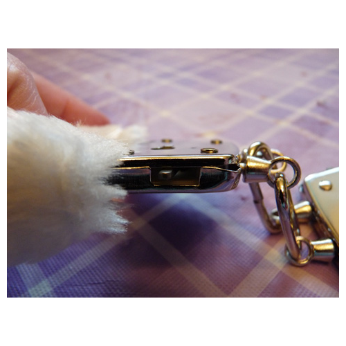 Fuzzy cuffs safety release latch